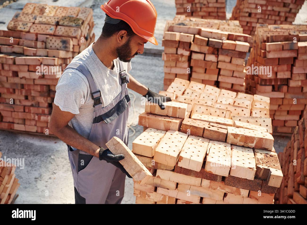 Handsome Indian man is on the construction site. Stock Photo