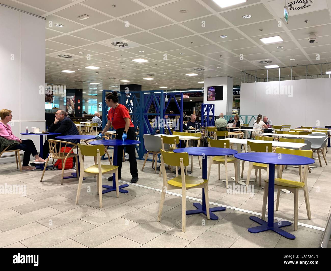 Tenerife Airport shop shopping food restaurant people sit sat floor waiting inside emergency exit flying hot food beer drink signs sign baggage glass - Smartphone Captured Stock Image