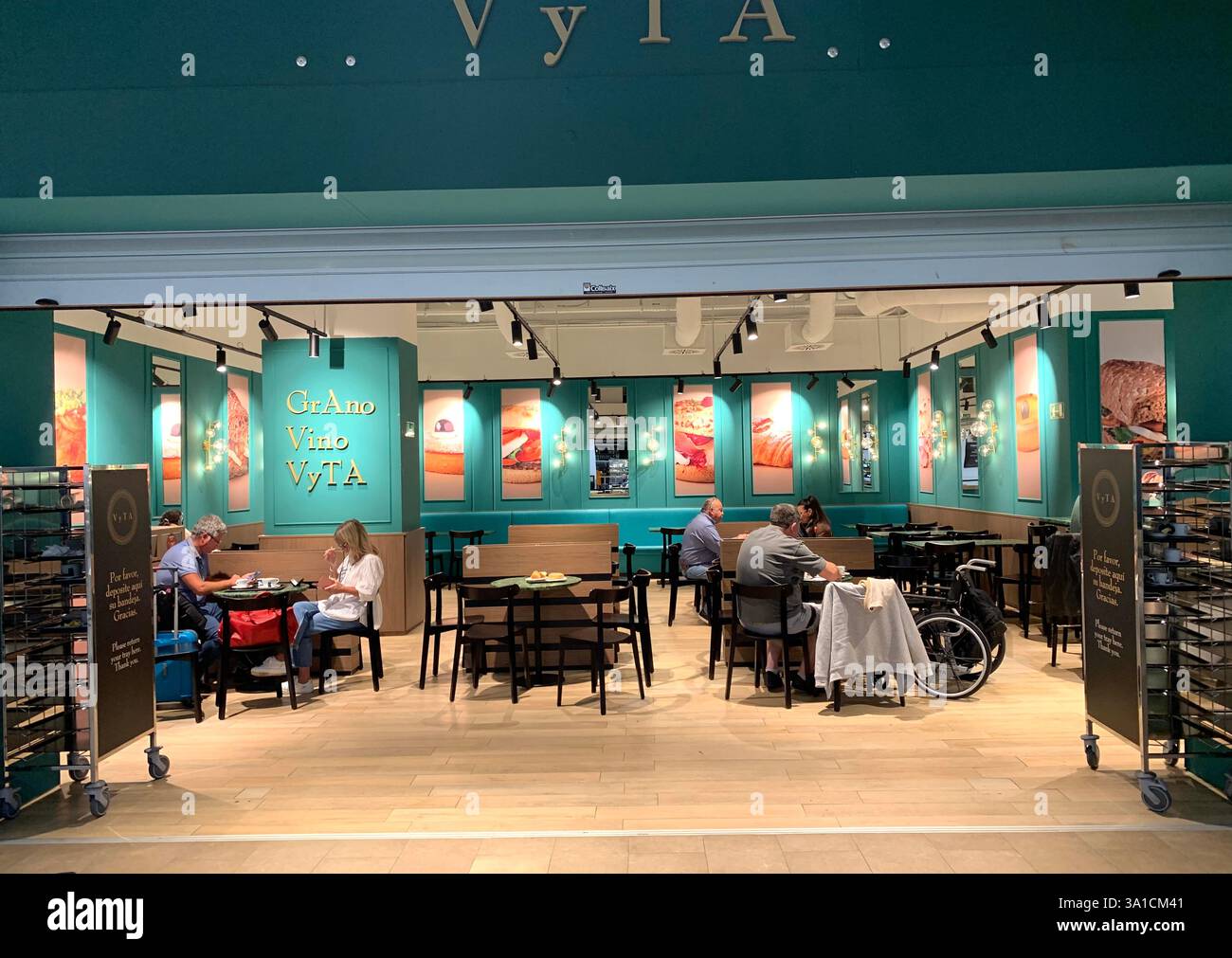 Tenerife Airport shop shopping food restaurant people sit sat floor waiting inside emergency exit flying hot food beer drink signs sign baggage glass - Smartphone Captured Stock Image