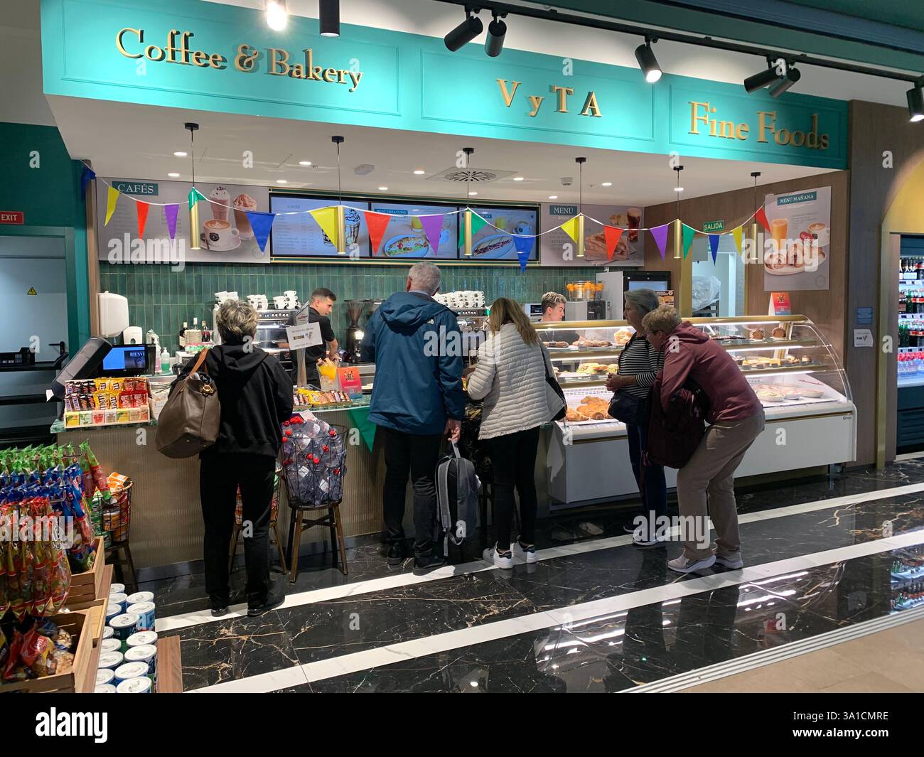 Tenerife Airport shop shopping food restaurant people sit sat floor waiting inside emergency exit flying hot food beer drink signs sign baggage glass - Smartphone Captured Stock Image
