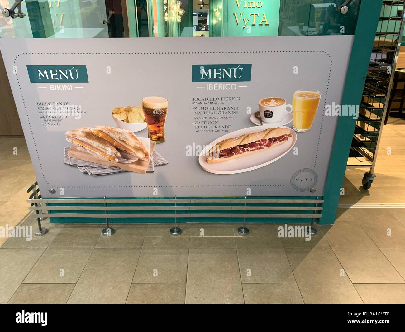 Tenerife Airport shop shopping food restaurant people sit sat floor waiting inside emergency exit flying hot food beer drink signs sign baggage glass - Smartphone Captured Stock Image