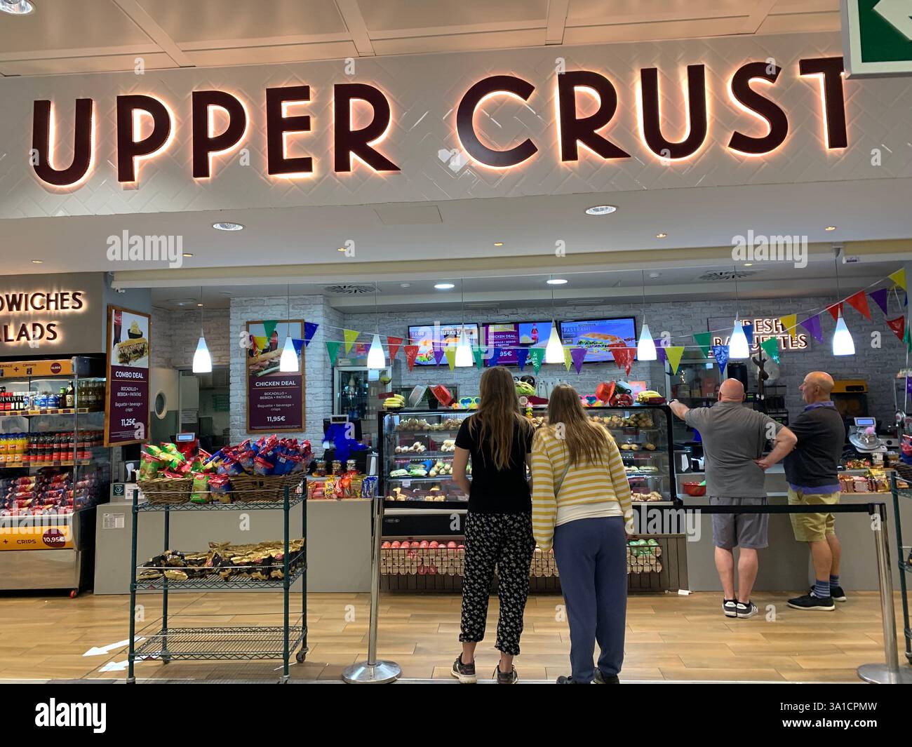 Tenerife Airport shop shopping food restaurant people sit sat floor waiting inside emergency exit flying hot food beer drink signs sign baggage glass - Smartphone Captured Stock Image
