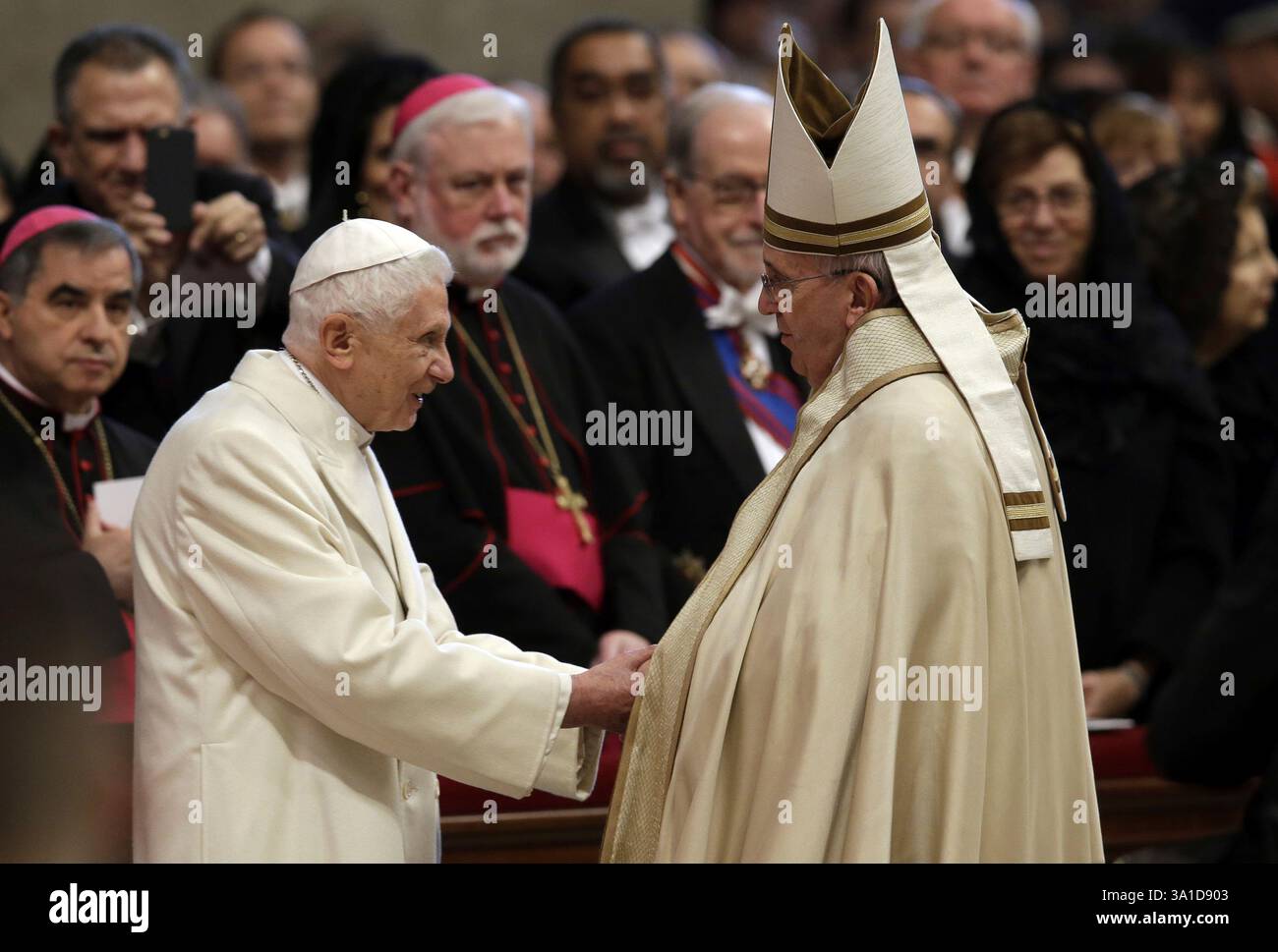 Pope Emeritus Benedict XVI, left, greets Pope Francis in St. Peter's ...