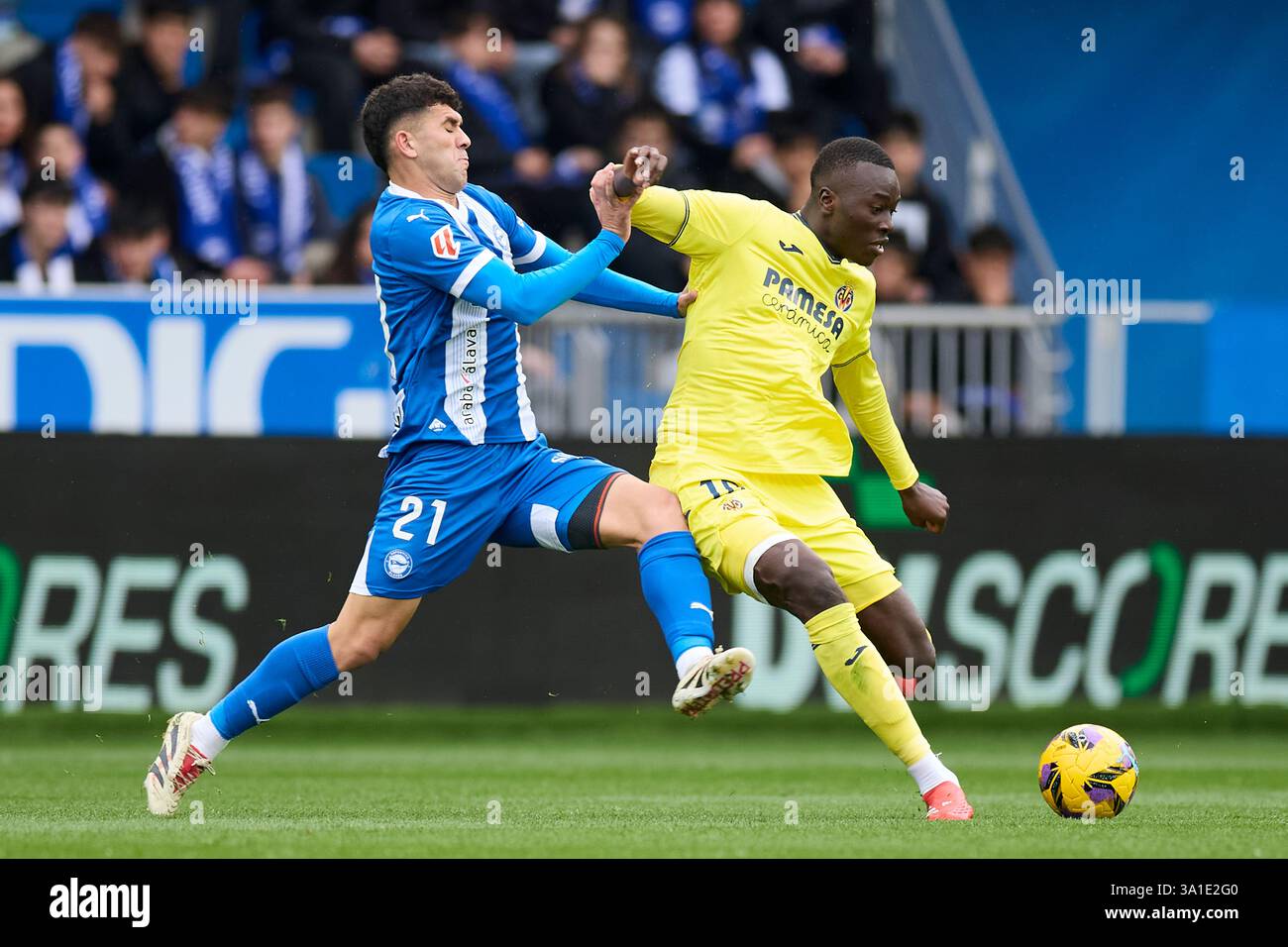 Carles Alena of Deportivo Alaves competes for the ball with Pape Gueye of  Villarreal CF during the LaLiga EA Sports match between Deportivo Alaves  and Villarreal CF at Mendizorrotza on March 8,