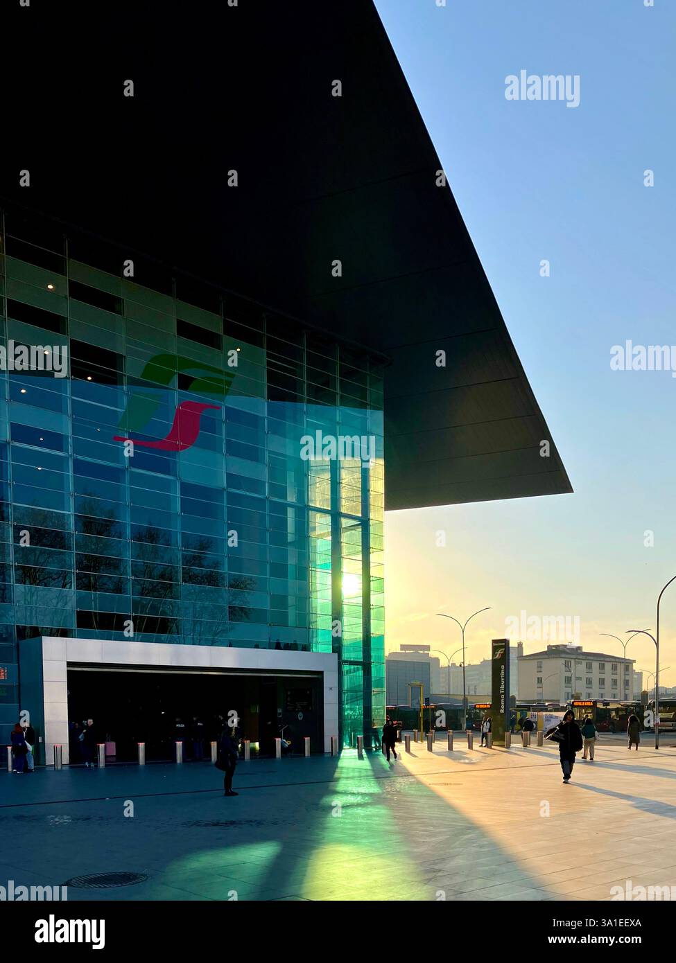 The entrance of Stazione Tiburtina, a major railway station in Rome, Italy, known for its modern glass and steel design. - Smartphone Captured Stock Image