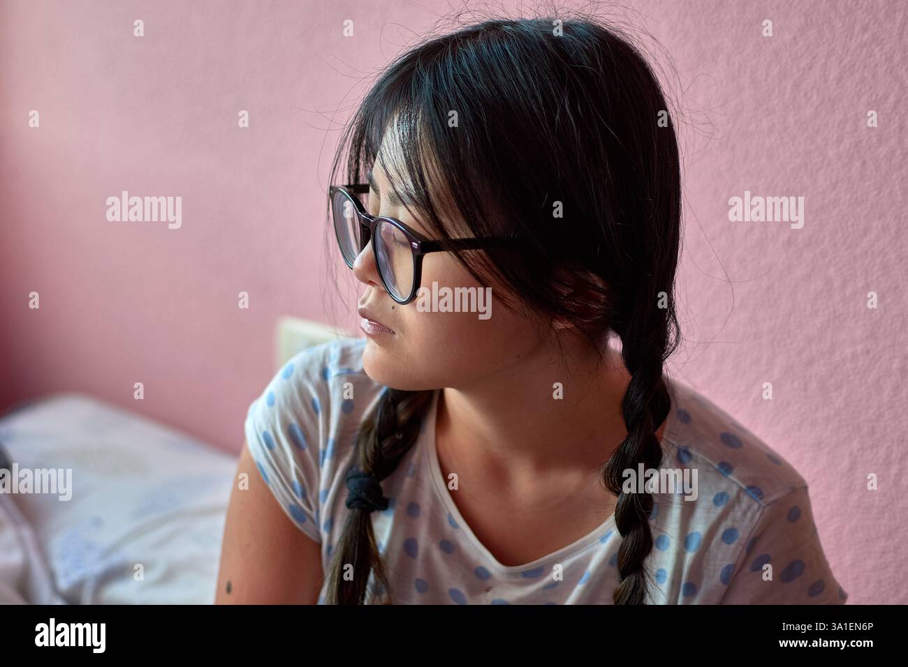 a-young-chinese-woman-with-autism-in-a-moment-of-introspection-gazing