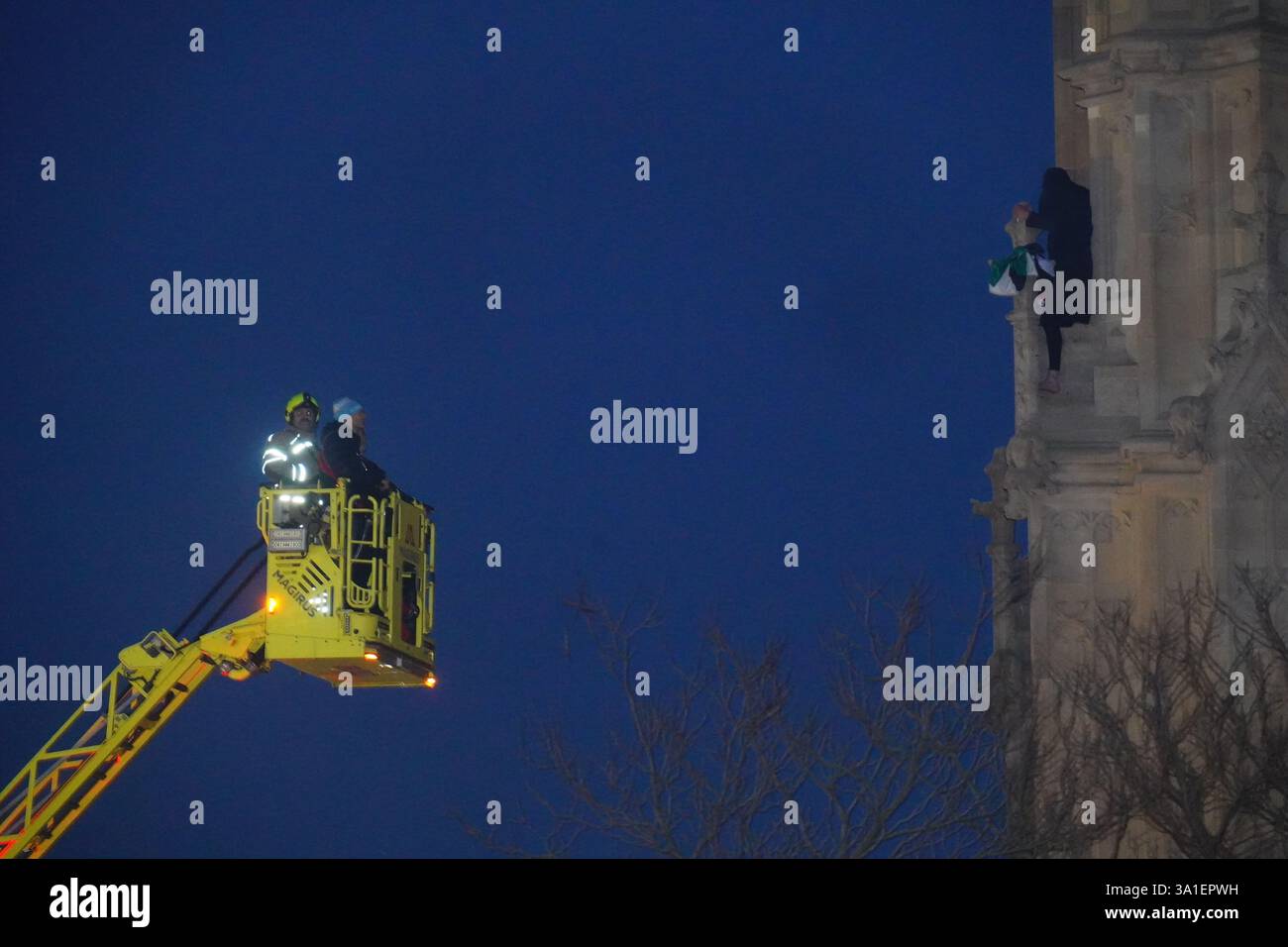 Emergency services talk to a man after he climbed up Elizabeth Tower at ...