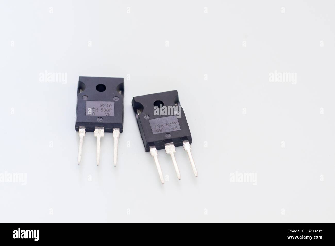 Transistor mounted on a breadboard with a white background. Stock Photo