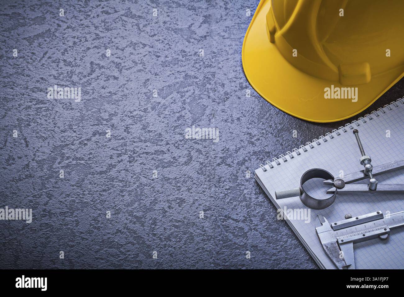 Notebook hard hat divider vernier scale copyspace construction concept Stock Photo