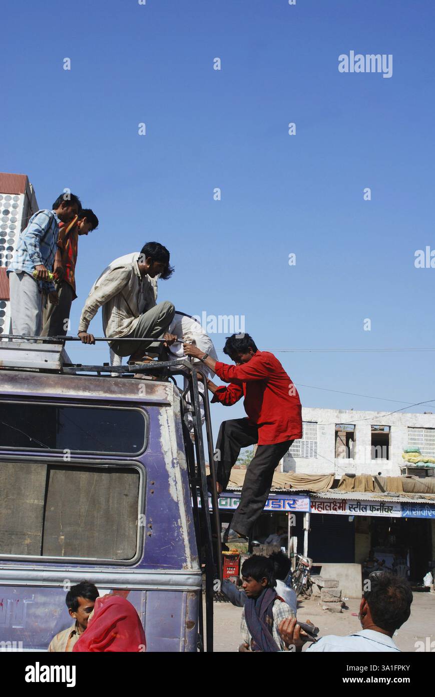 Passengers sitting on roof top of bus, Jodhpur, Rajasthan, India, Asia ...