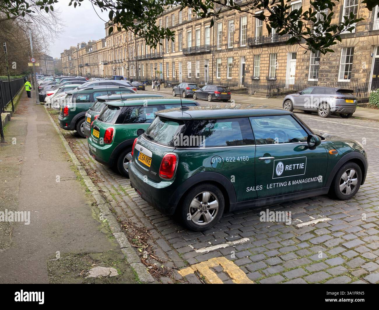 Rettie & Co. Real Estate Agent, pool cars parked up in the New Town Heriot Row, Edinburgh, Scotland Stock Photo