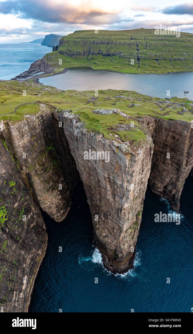 Stunning Aerial View Of Faroe Islands Cliffs In Late Summer Stock Photo stunning-aerial-view-of-faroe-islands-cliffs-in-late-summer-stock-photo