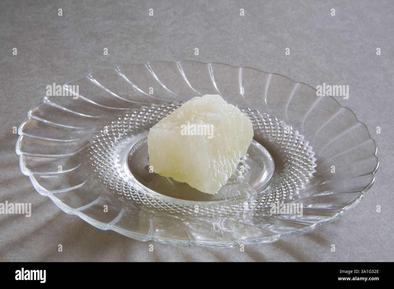 Indian sweet petha bon-bon confectionery mithai made from white pumpkin peeled and cubed with deep fry in sugar syrup served in plate, India, Asia Stock Photo