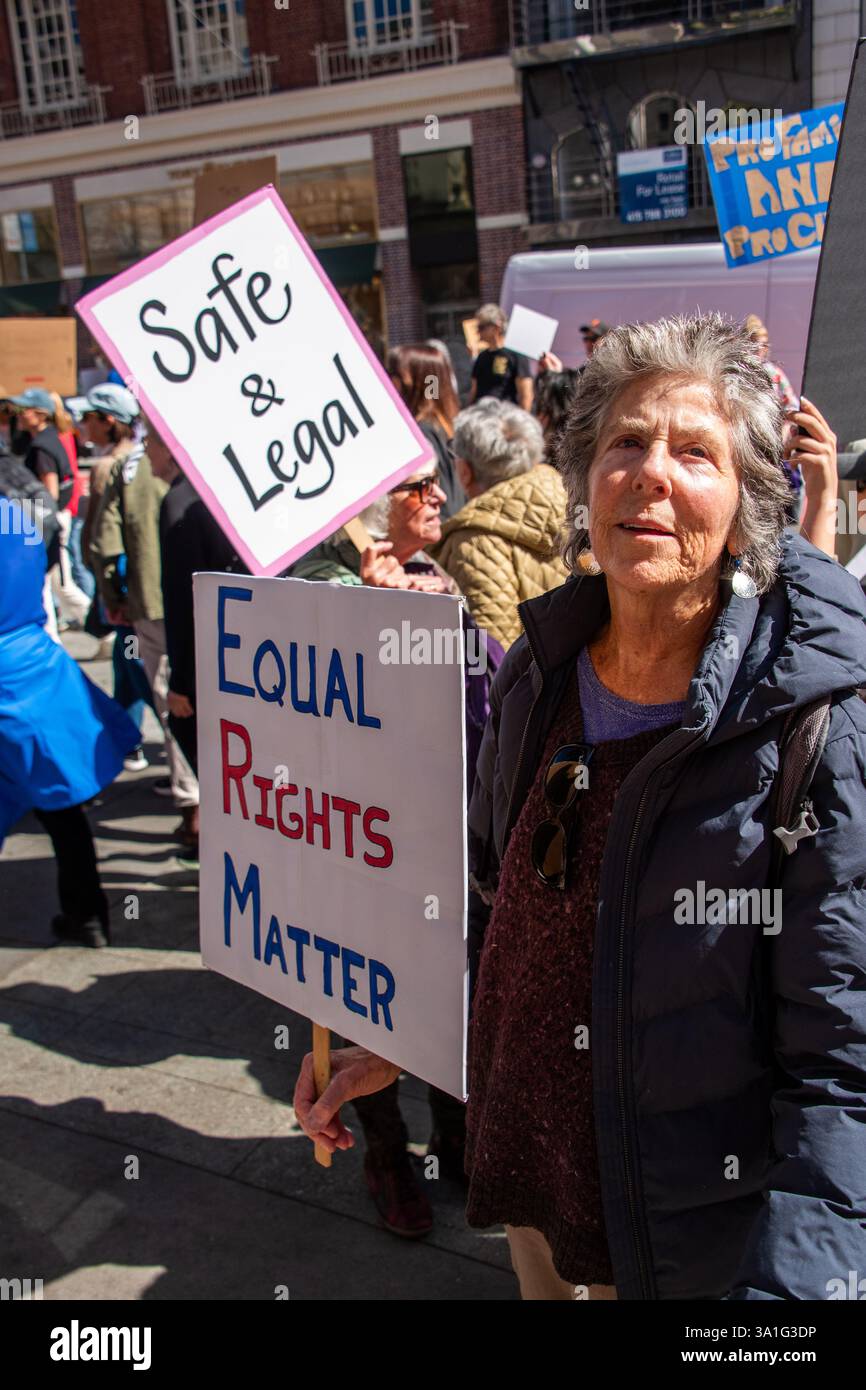 San Francisco, USA. 8th Mar 2025. Hundreds gather to rally and protest in honor of International Women’s Day at San Francisco's Union Square.  Women in the crowd hold signs reading, 'Safe and Legal,' and 'Equal Rights Matter.' Credit: Shelly Rivoli/Alamy Live News Stock Photo
