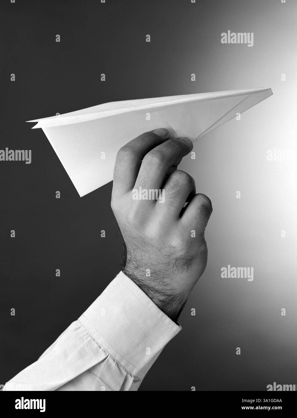 Hand & paper plane Stock Photo