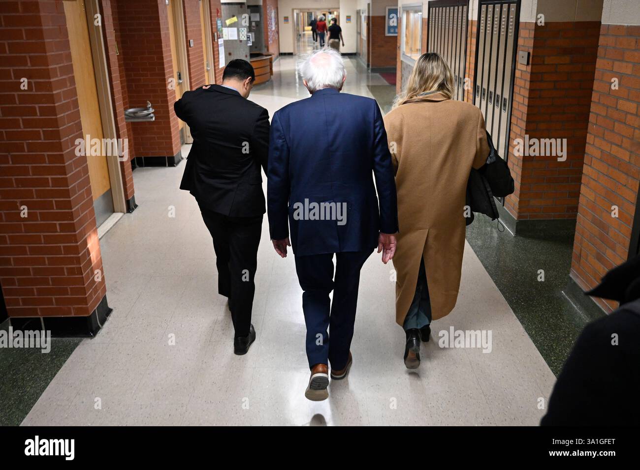 Sen. Bernie Sanders, I-Vt., center, walks to greet an overflow crowd ...