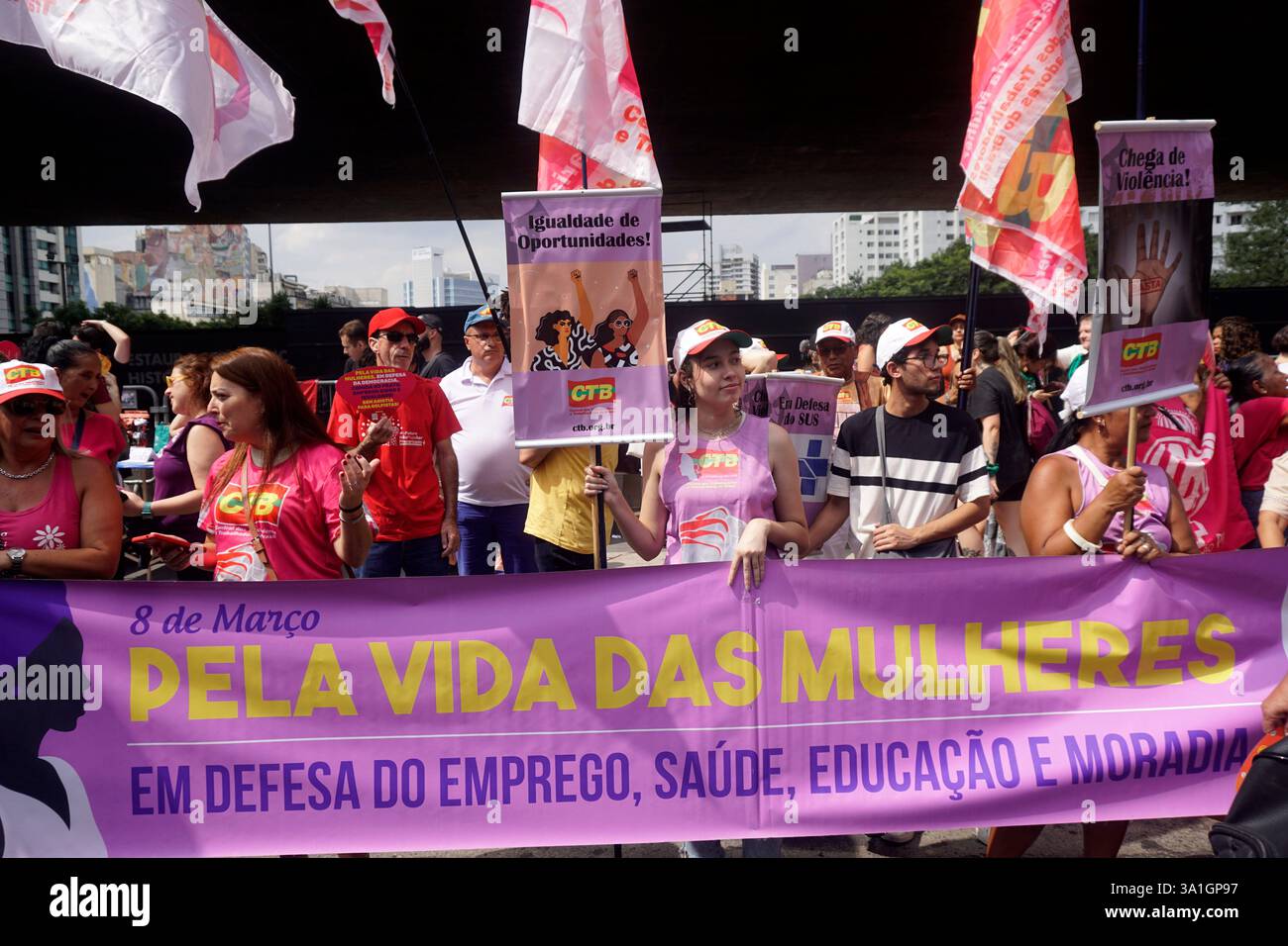 Women take part in a march to mark International Women's Day in Sao