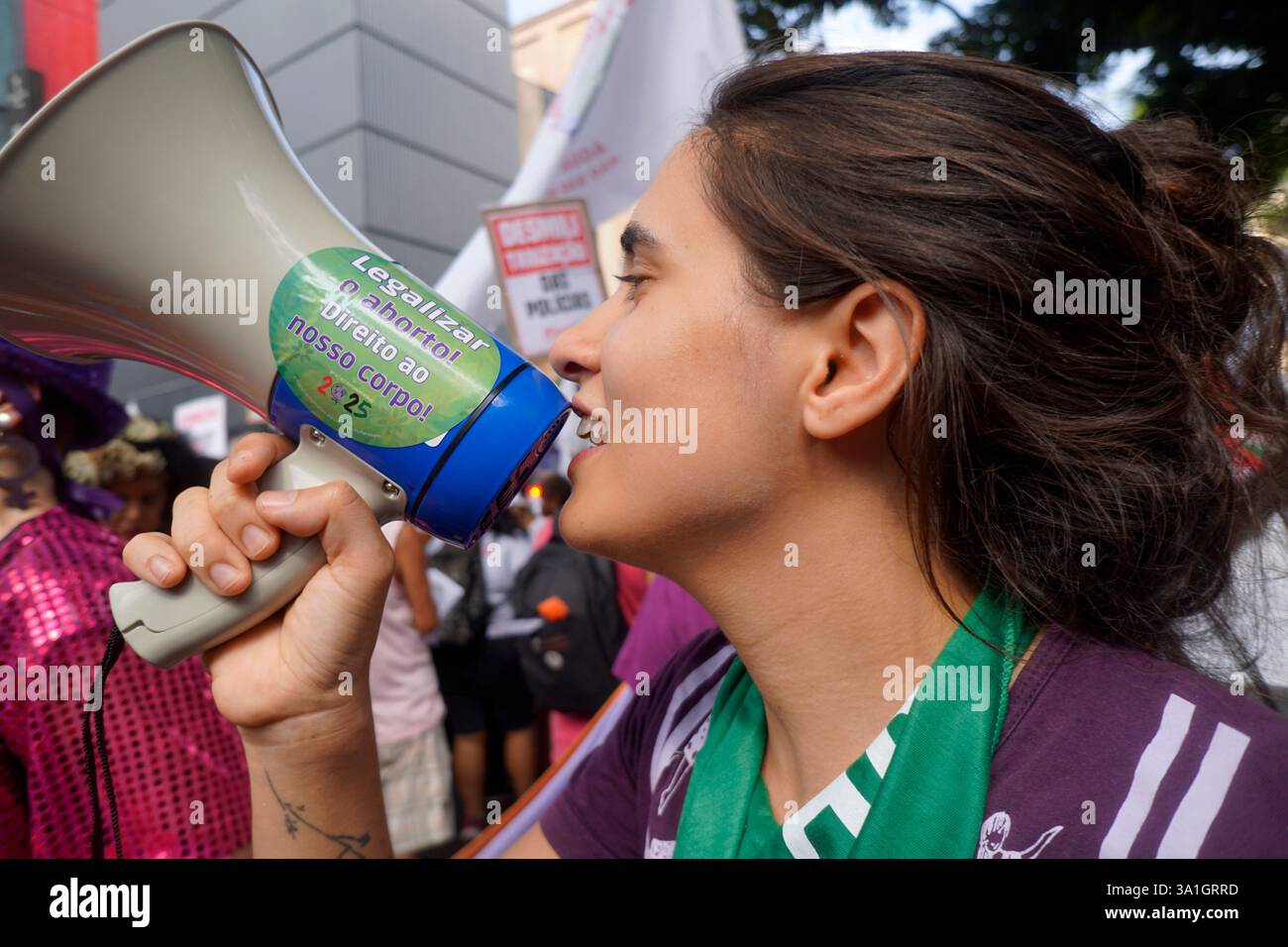 Women take part in a march to mark International Women's Day in Sao
