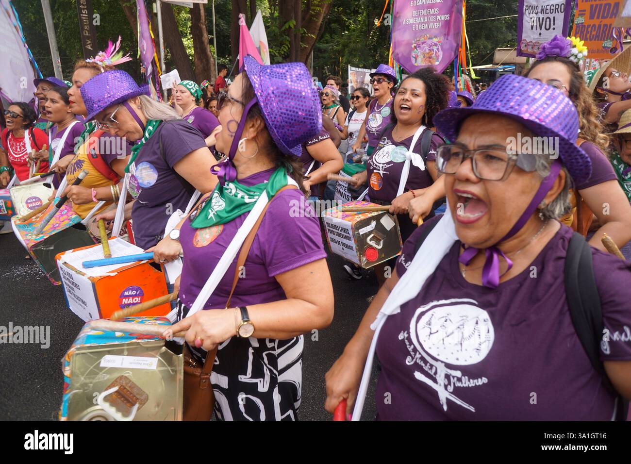 Women take part in a march to mark International Women's Day in Sao