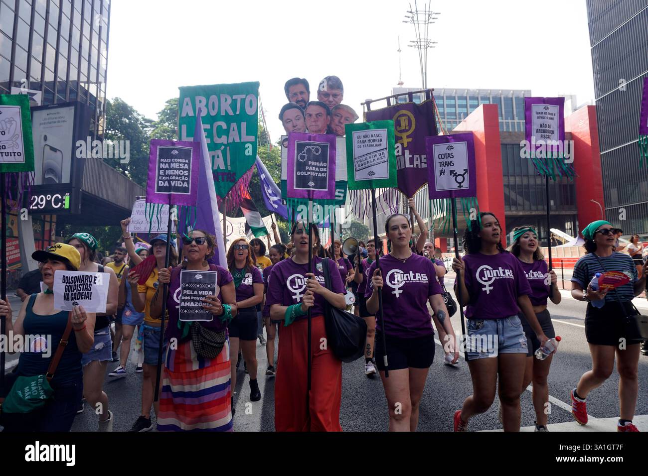 Women take part in a march to mark International Women's Day in Sao