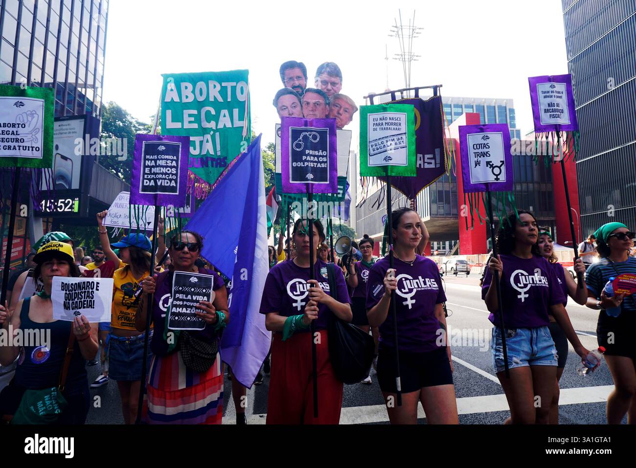 Women take part in a march to mark International Women's Day in Sao