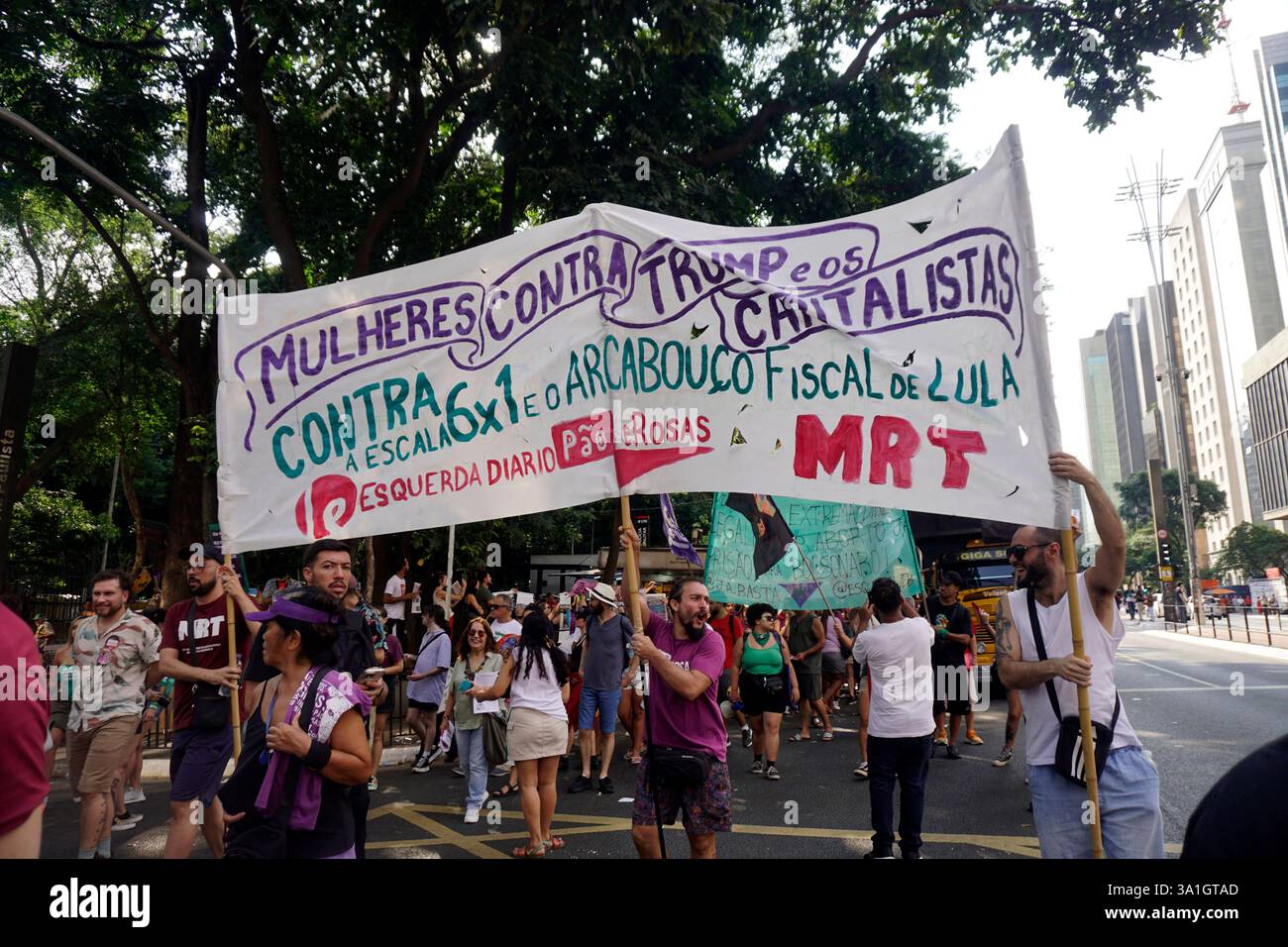 Women take part in a march to mark International Women's Day in Sao