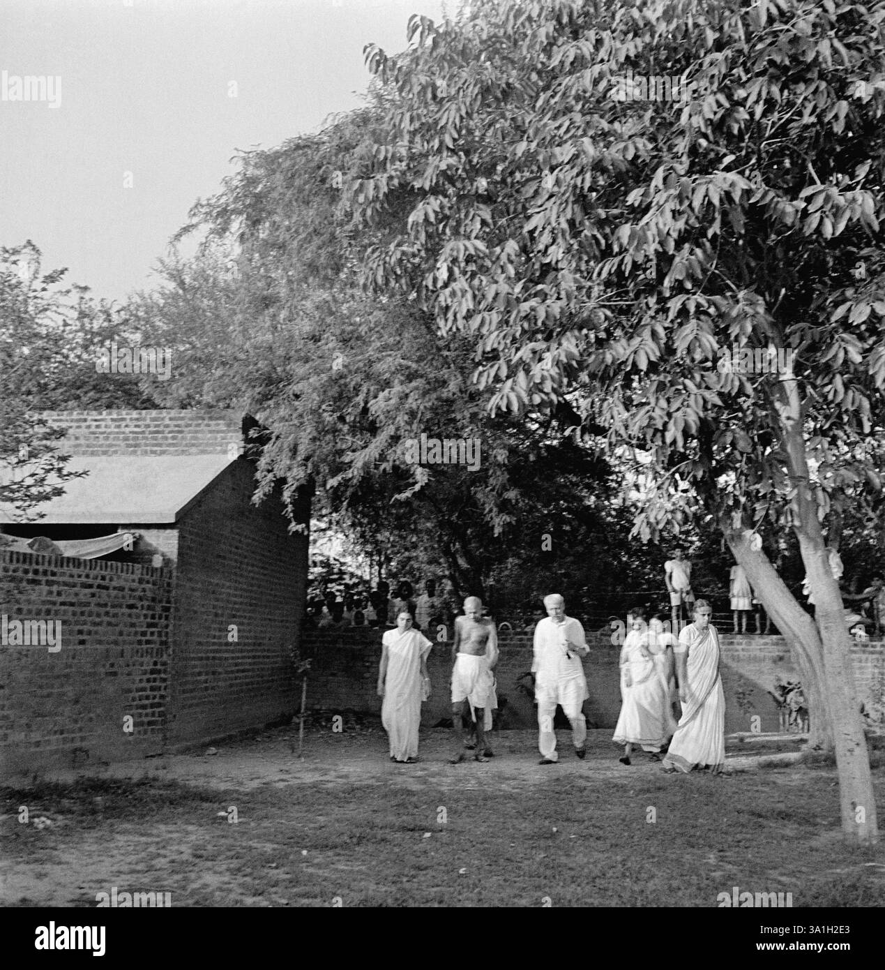 Mahatma Gandhi walking with Sushila Nayar, Sushila Pai, Abha Gandhi ...