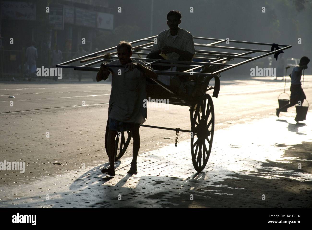 Old Loading Rickshaw Street scene, hand rickshaw puller pulling with passenger and load on ...