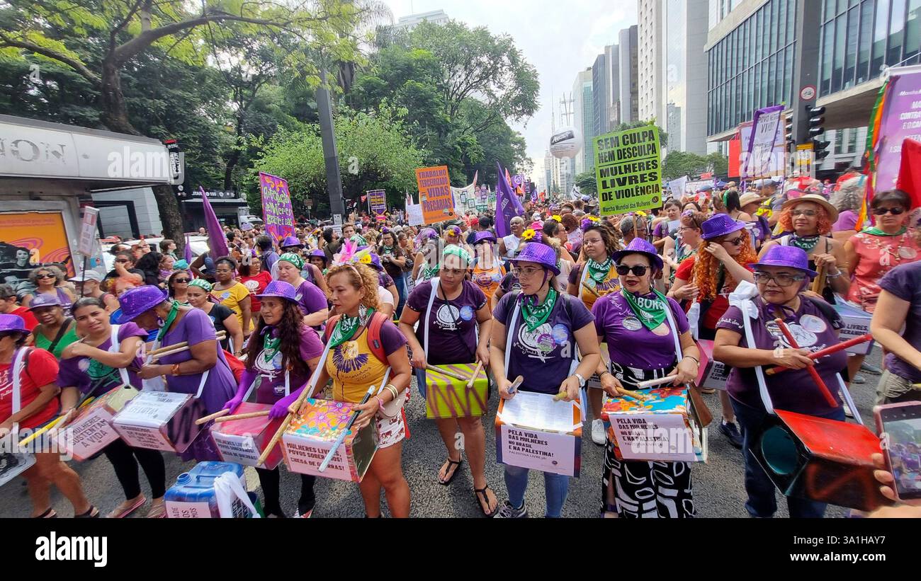 Women take part in a march to mark International Women's Day in Sao