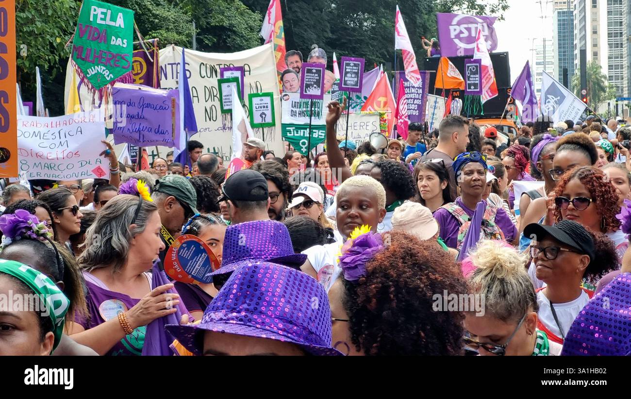 Women take part in a march to mark International Women's Day in Sao
