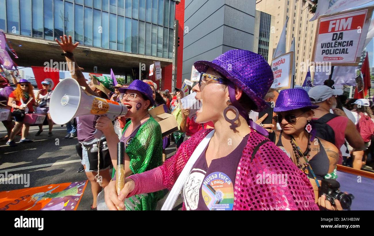 Women take part in a march to mark International Women's Day in Sao