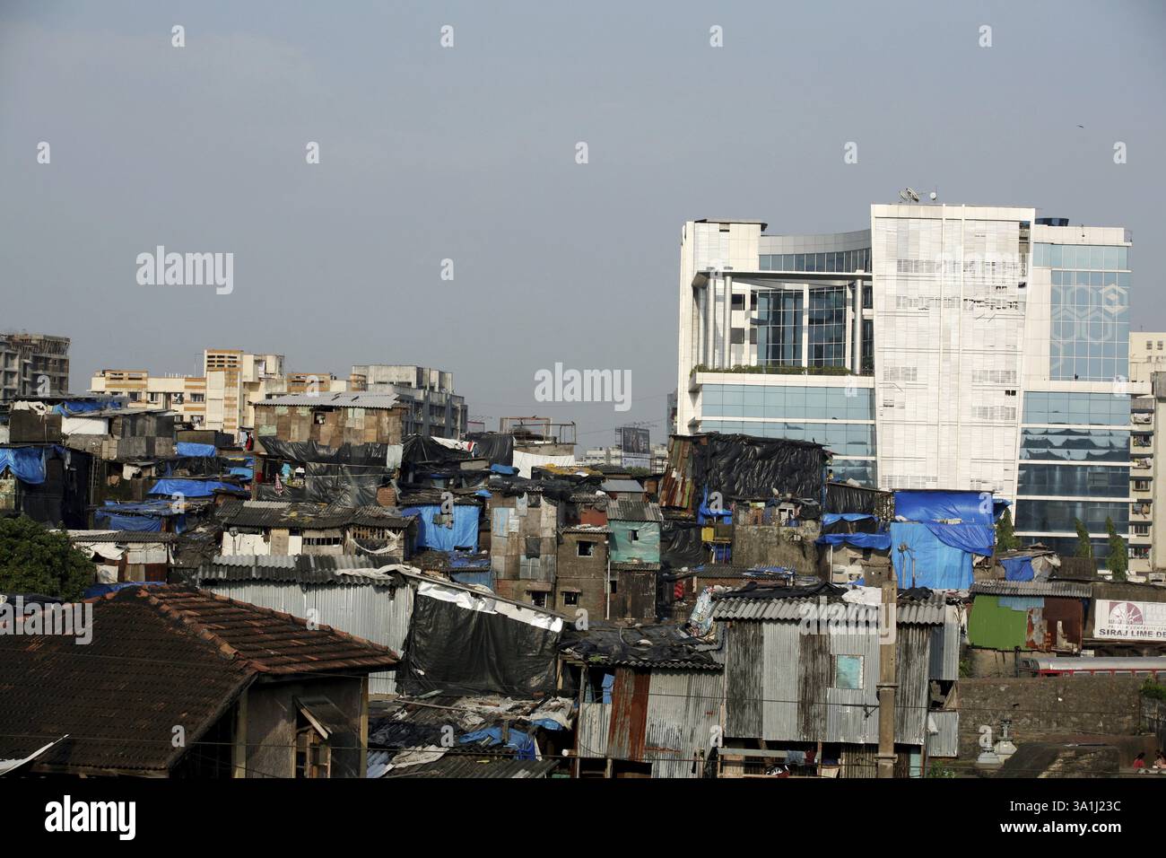 New constructed corporate office standing amidst slums of Behrampada in ...