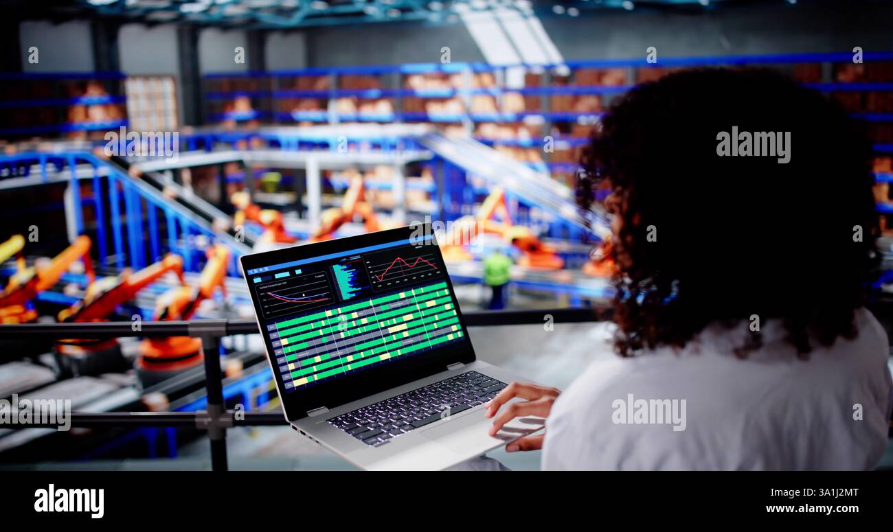 Engineer Worker Using Warehouse Automation Dashboard In Logistic Center Stock Photo