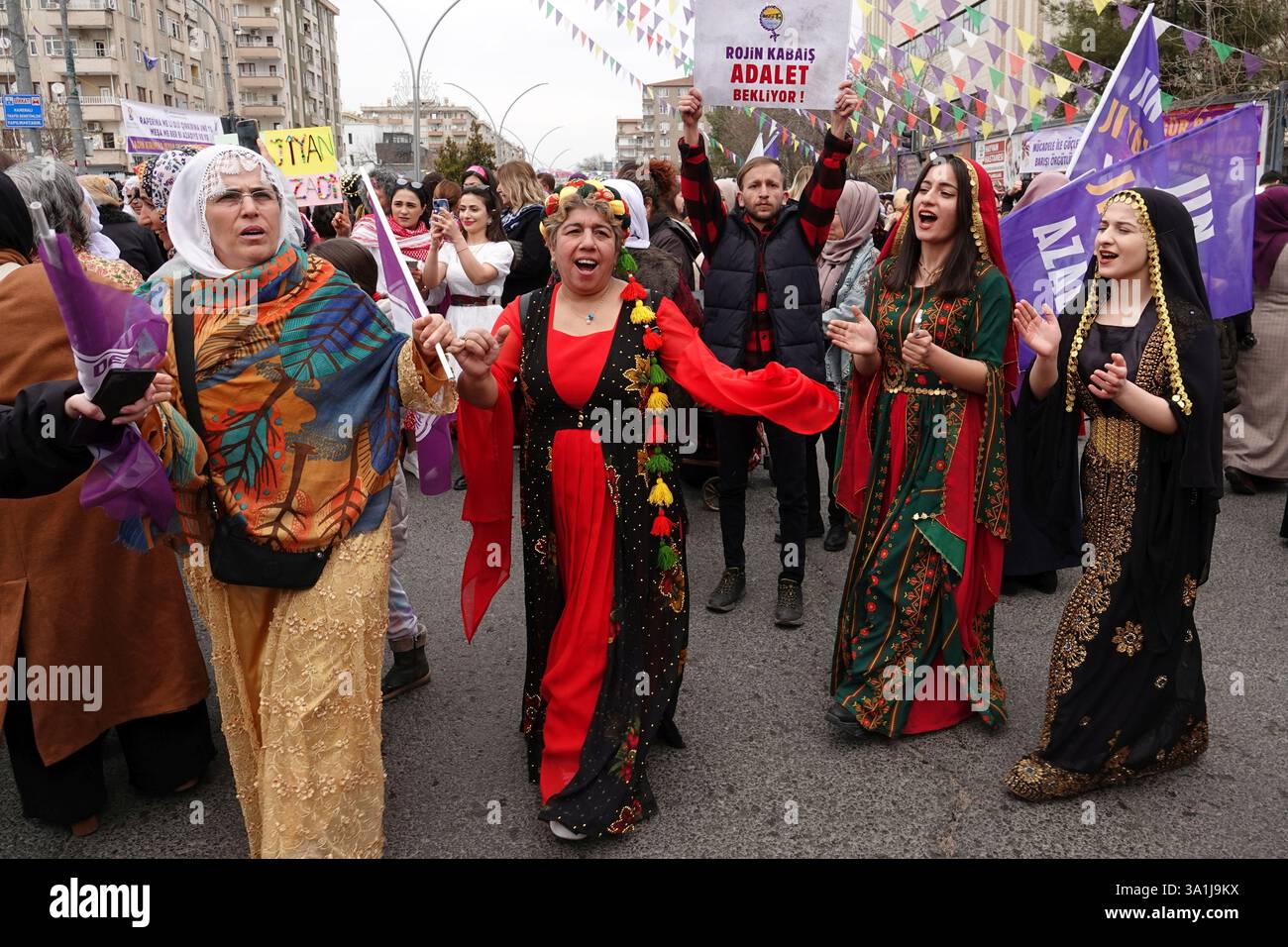 Kurdish women are seen dancing and chanting slogans at the celebration ...