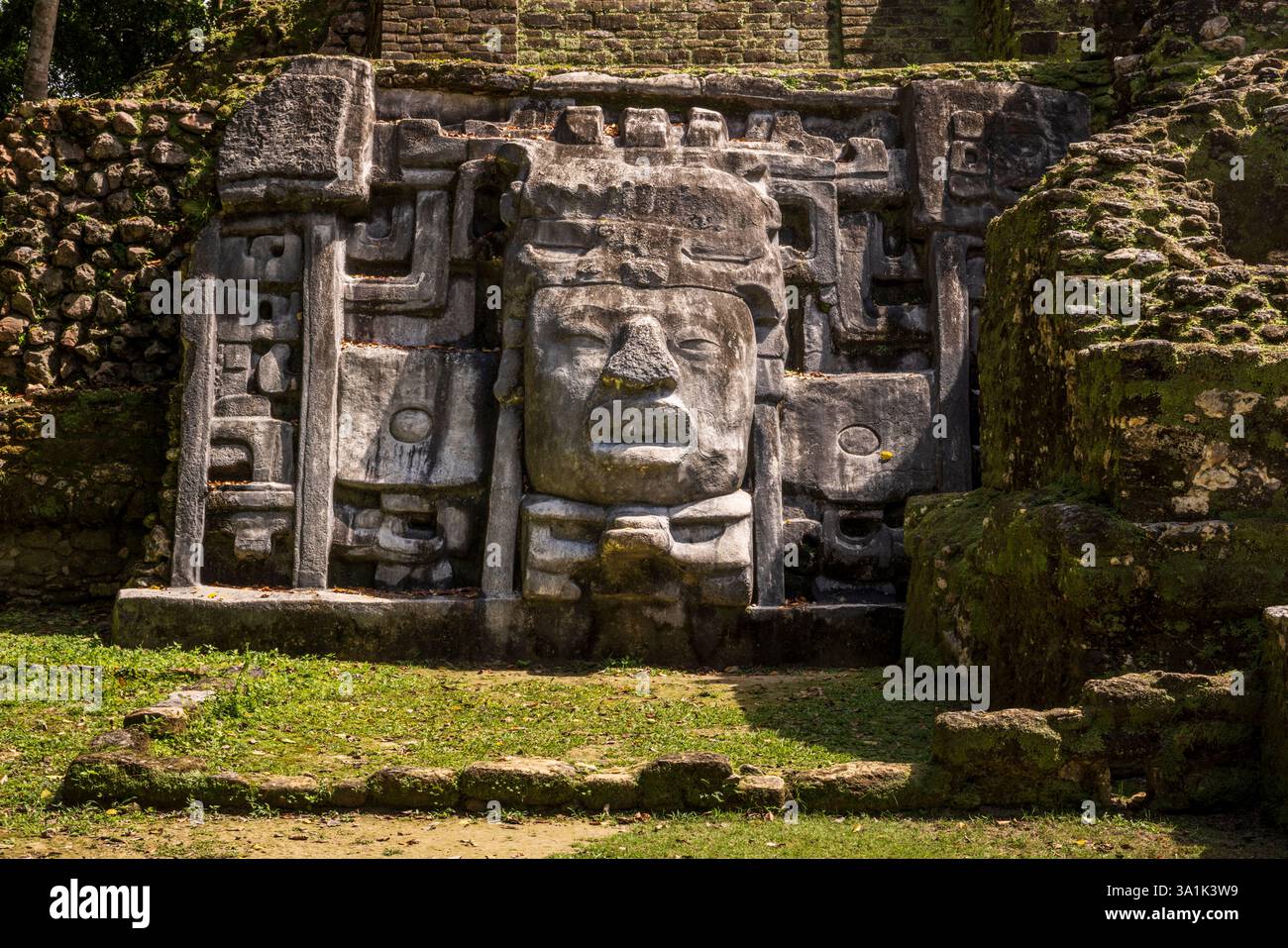 The Temple of the Mask at jungle ruins of the Lamanai Mayan Archaeological site, Belize, Central America Stock Photo