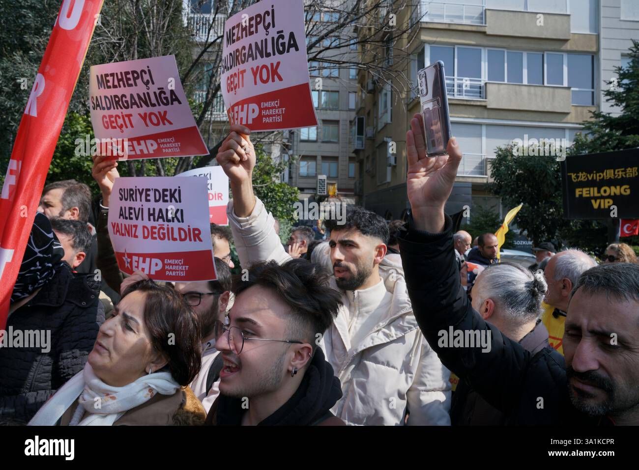 Sisli, Istanbul, Turkey. 9th Mar, 2025. A protester hold placards ''No way for sectarian aggression.'' during a protest demonstration against the deaths of Alawites in Syria in front of Macka Park near the Syrian Consulate General in Istanbul onÂ MarchÂ 9,Â 2025. (Credit Image: © Tolga Uluturk/ZUMA Press Wire) EDITORIAL USAGE ONLY! Not for Commercial USAGE! Stock Photo