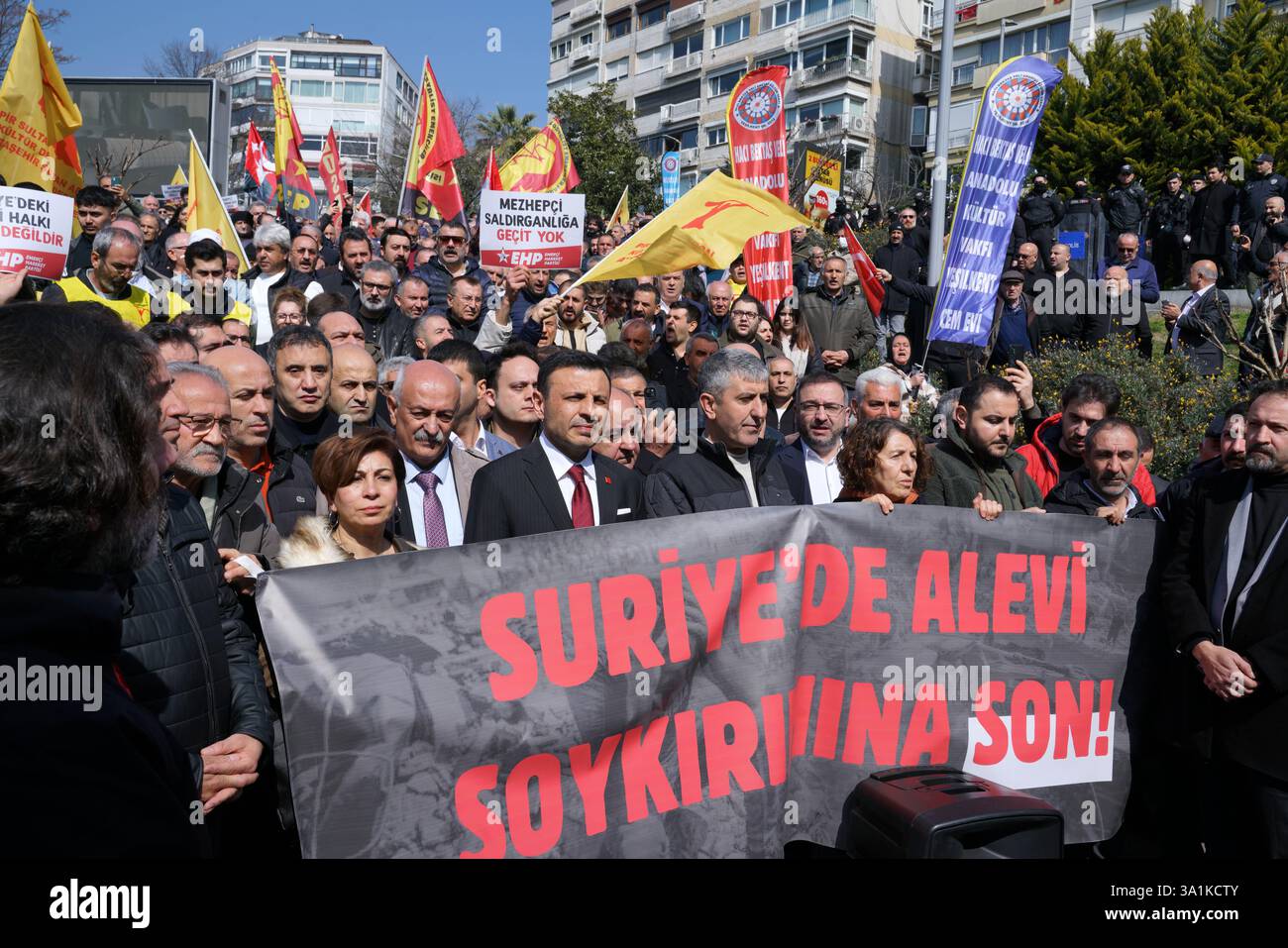 Sisli, Istanbul, Turkey. 9th Mar, 2025. Protesters stand behind banner reading ''End the Alawite Genocide in Syria'' during a protest demonstration against the deaths of Alawites in Syria in front of Macka Park near the Syrian Consulate General in Istanbul onÂ MarchÂ 9,Â 2025. (Credit Image: © Tolga Uluturk/ZUMA Press Wire) EDITORIAL USAGE ONLY! Not for Commercial USAGE! Stock Photo