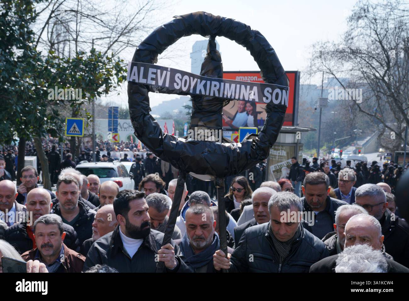 Sisli, Istanbul, Turkey. 9th Mar, 2025. Protesters carry a black wreath with the words ''End the Alawite Genocide'' written on it during a protest demonstration against the deaths of Alawites in Syria in front of Macka Park near the Syrian Consulate General in Istanbul onÂ MarchÂ 9,Â 2025. (Credit Image: © Tolga Uluturk/ZUMA Press Wire) EDITORIAL USAGE ONLY! Not for Commercial USAGE! Stock Photo
