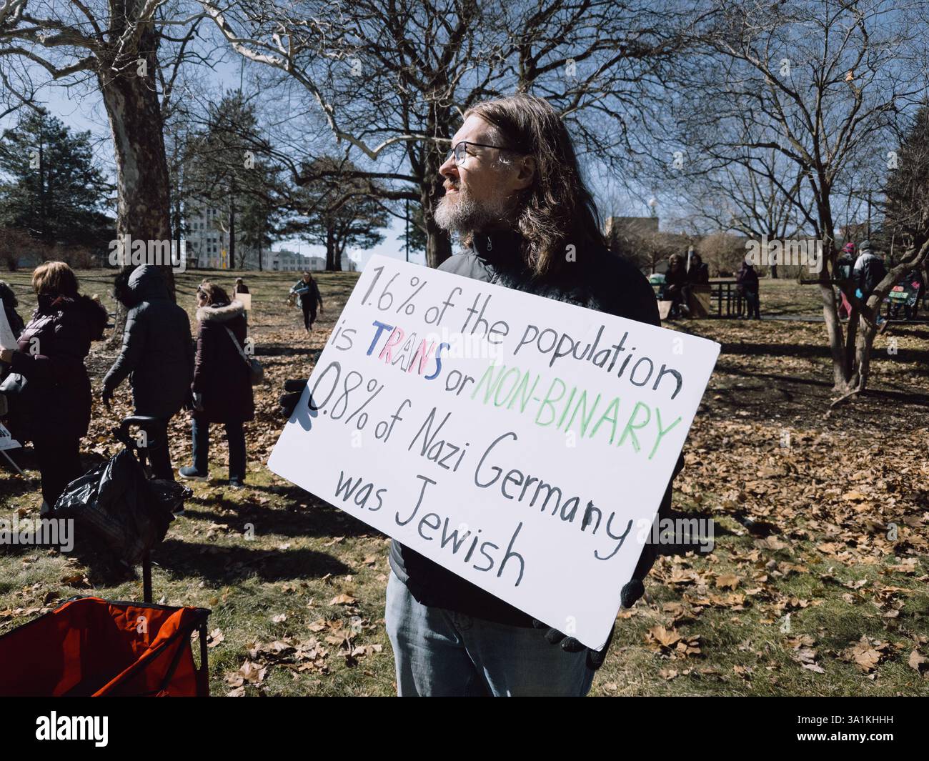 Equal rights protester at the International Women's Day Rally in Flint Michigan USA, March 8 2025 - Smartphone Captured Stock Image
