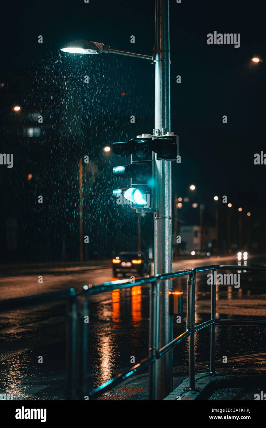 Traffic Light in the Rain with Green Signal Stock Photo