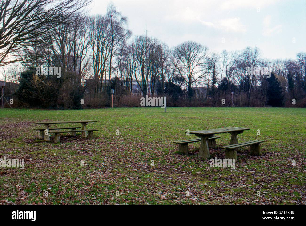 Picknick Benches in Meadow. Wooden, 1960 s Designed Picknick Table & Benches on a Neighbourhood Meadow at Woensel, Eindhoven, Netherlands. Shot on Analog Color Film. Eindhoven Woensel Noord-Brabant Nederland Copyright: xGuidoxKoppesxPhotox Stock Photo