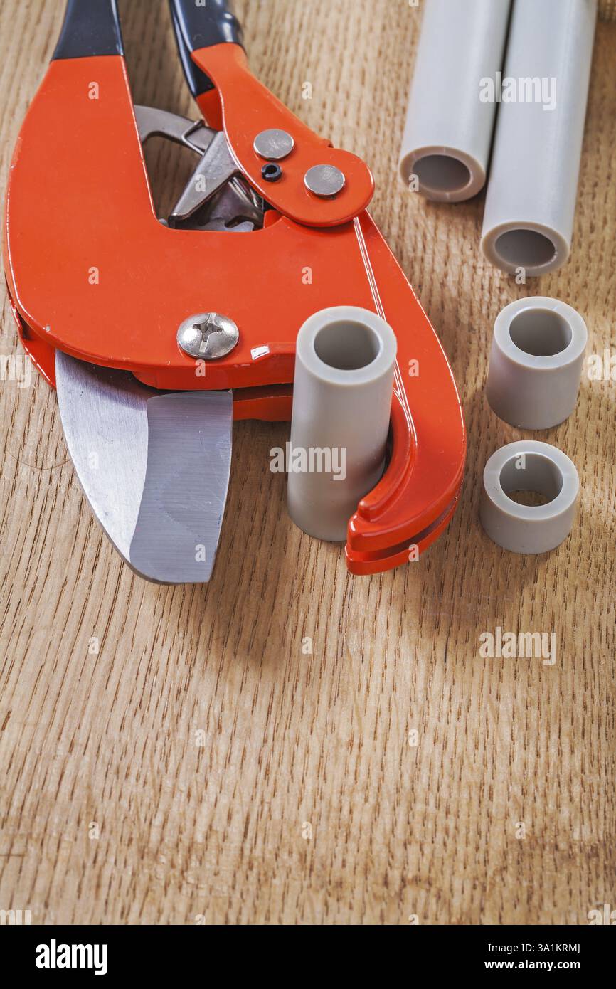 Pipe cutter with cutted pipes Stock Photo