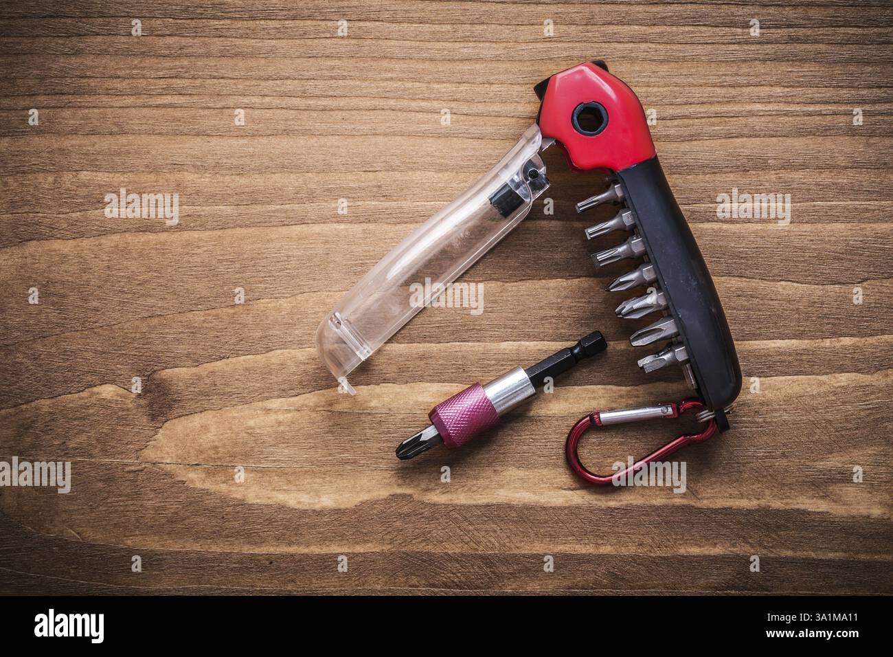 Replaceable turnscrew bits in toolbox on wooden board construction concept Stock Photo