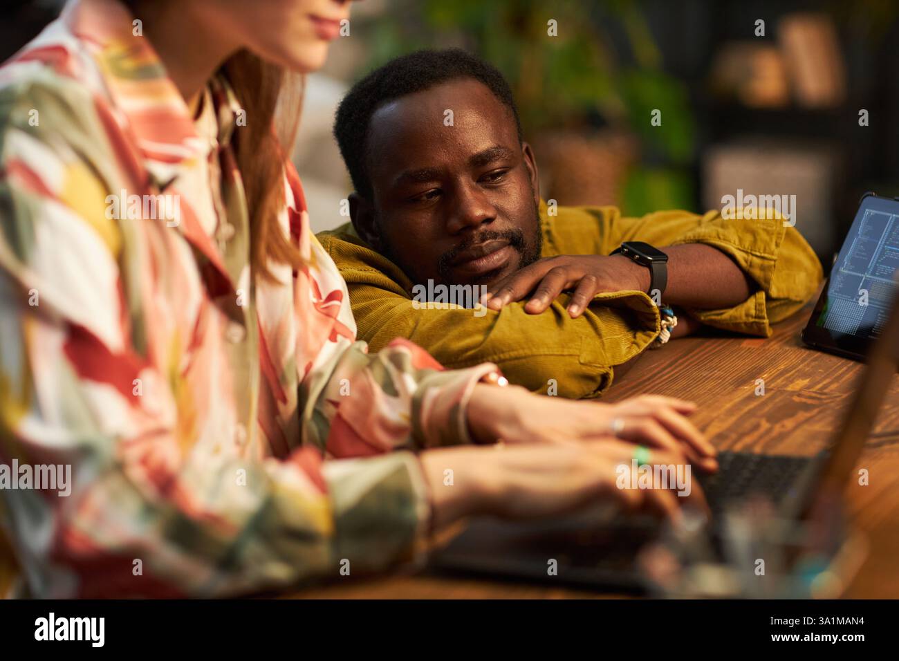 Man Watching For The Work Of Programmer Stock Photo