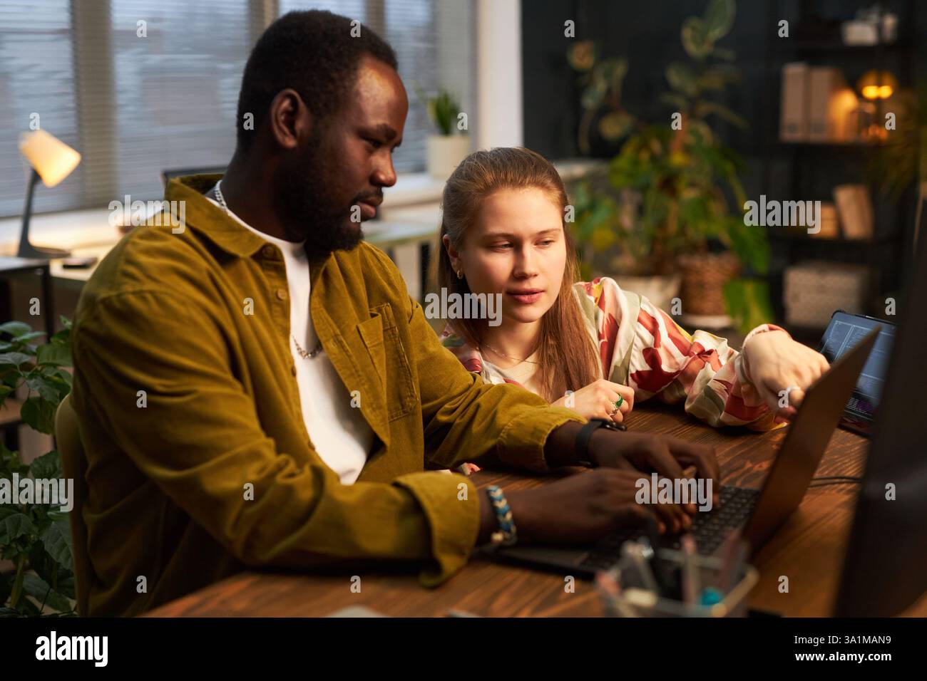 Colleagues Working Over Security Codes Stock Photo