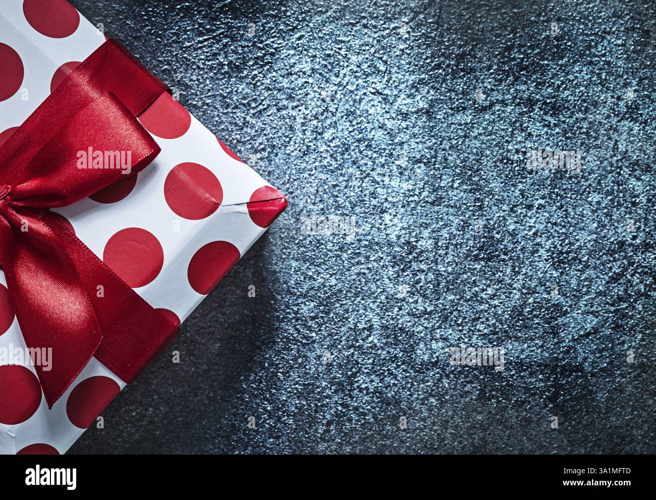 Red gift box on black background holidays concept Stock Photo - Alamy