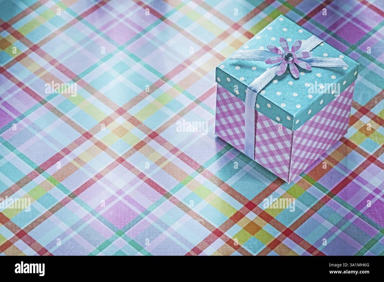 Present box on checked fabric background holidays concept Stock Photo ...