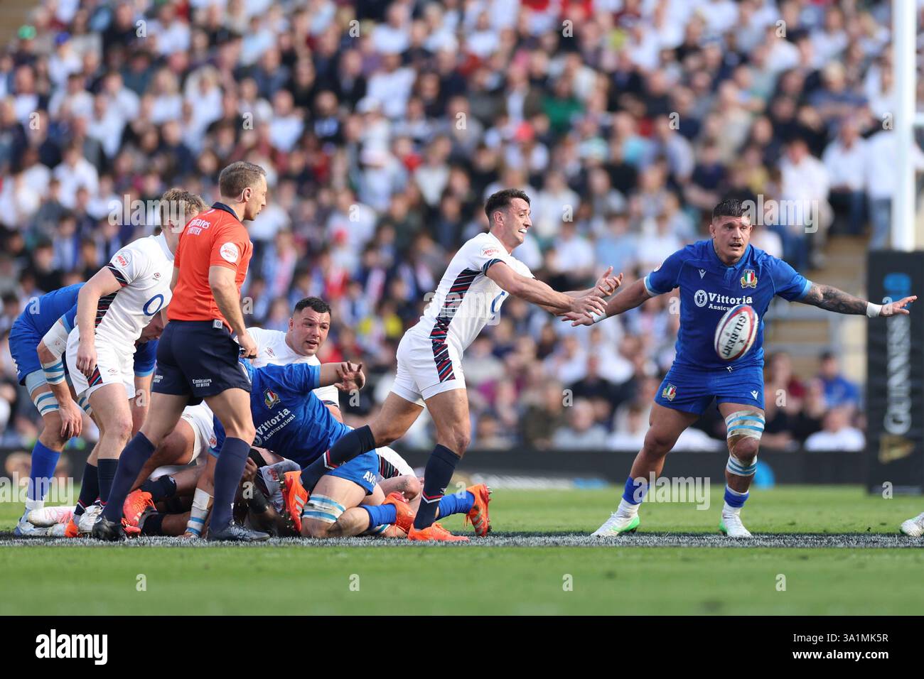 England's Alex Mitchell gets the ball away from a ruck during the Six ...