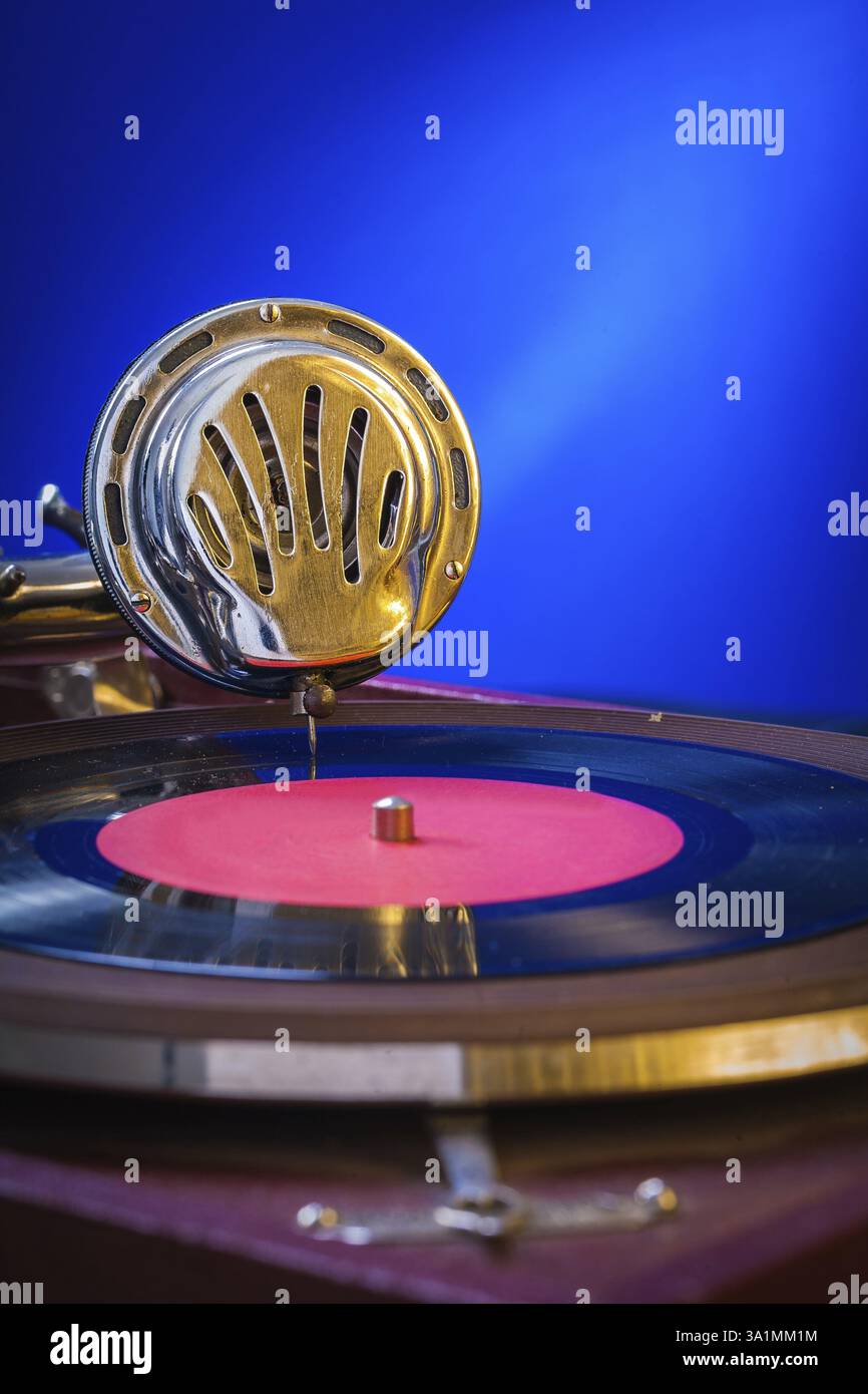 Old gramophone on blue background very close up Stock Photo