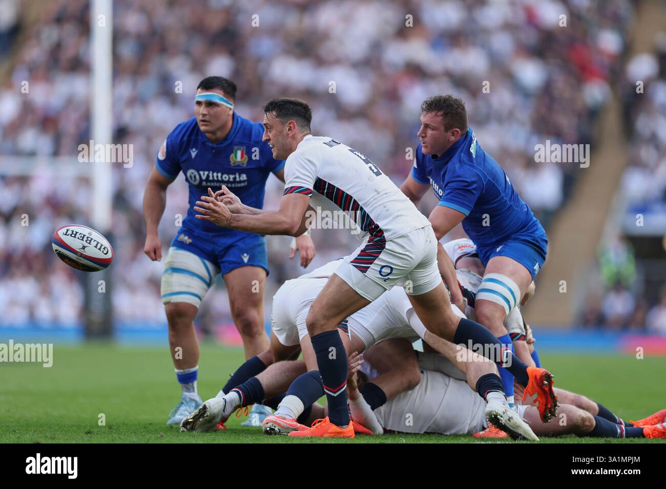 England's Alex Mitchell throws the ball out from a ruck during the Six ...